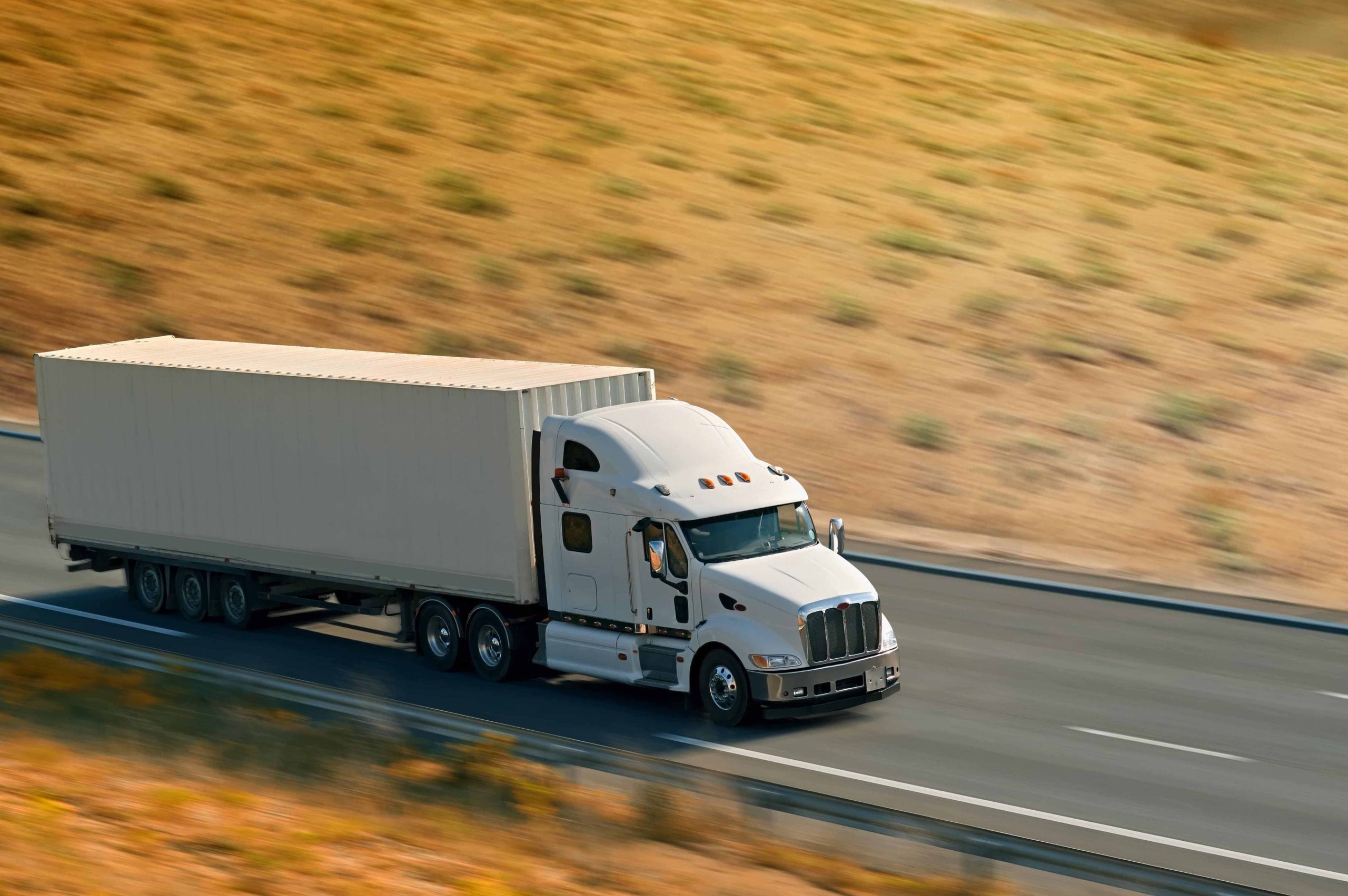 Semi truck driving on highway at daytime